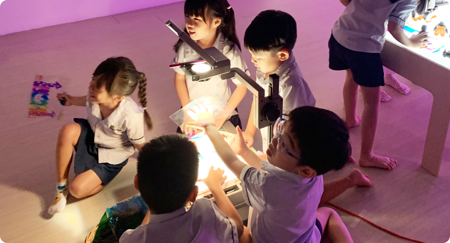 Children explore light and shadows together at Apple Tree Playhouse childcare in Yishun
