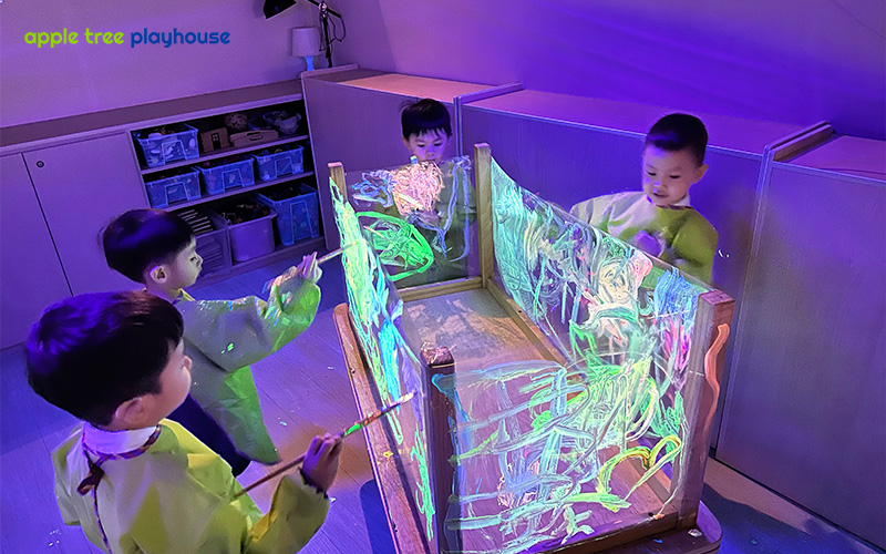 Curious kids engaged in inquiry-based learning with colourful materials